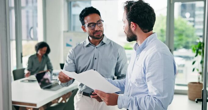 Business, people and talking with document in office for discussion, partnership and finance report. Team, men and handshake with paperwork for agreement, financial deal and smile for funding success