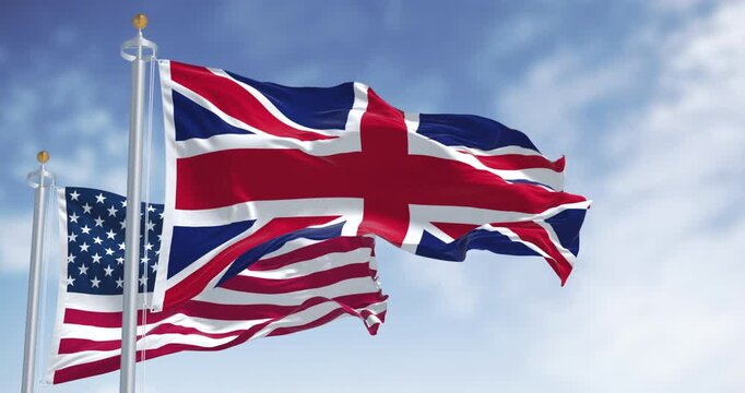 National flags of the Unites States and United Kingdom waving in the wind