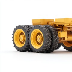 Obraz premium Yellow Heavy Duty Industrial Vehicle with Large Tires on White Background for Construction and Transportation Applications
