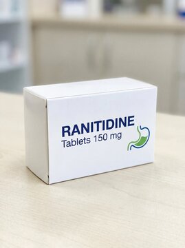Medicine box of Ranitidine. White box with some small graphic design, light neutral background.bright, professional photo