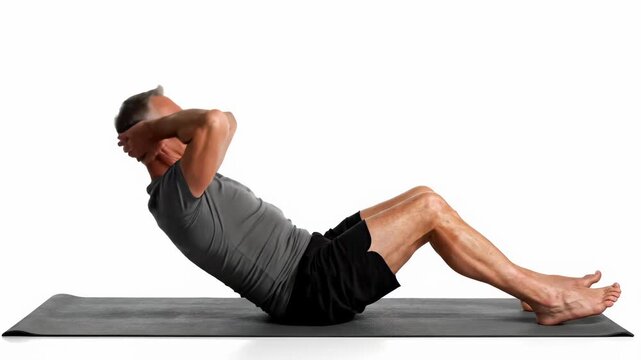Man performing sit-ups on a yoga mat for core strength and fitness.