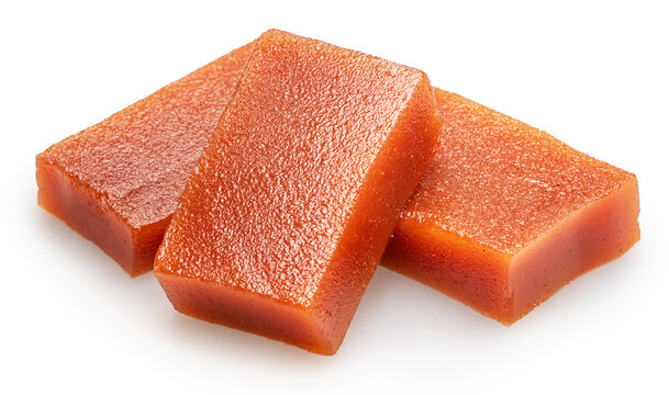Quince paste cubes or quince marmalade cubes on white background. File contains clipping paths.