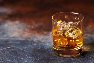 Glass of whiskey with ice