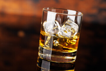 Glass of whiskey with ice