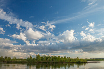 Sunny summer landscape with river and field