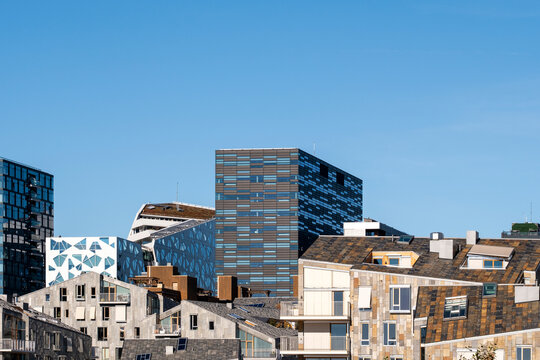Modern architecture and apartment buildings in daylight beneath wide sky in Oslo Barcode district Norway showing new urban housing