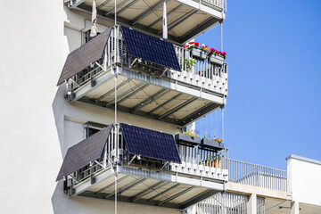 Modern Balcony with Solar Panels Mini Station. Solar Panel Mounting Balcony Railing. Solar Energy System for Apartment Building. Mini Solar system for Apartment. Renewable Energy in City Apartment. © Maryana