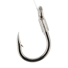 Close up of shiny metal fishing hook with line attachment