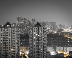 In China&rsquo;s major city Nanjing, the night skyline dazzles from above with dense skyscrapers, glittering lights, and a bold black-and-gold glow.