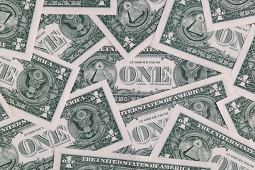 Background Pattern of Scattered One US Dollar Bills Showing Reverse Side Symbols