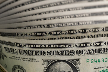 Macro View of Stacked One US Dollar Bills with Focus on George Washington Portrait