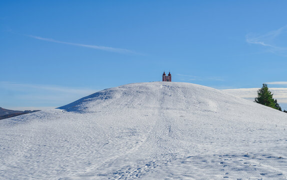 Banska Stiavnica Calvary Church Atop Wide Snowy Hill Under Blue Sky Slovakia