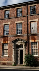 Obraz premium Elegant Georgian Architecture - A Timeless Brick Building Facade.