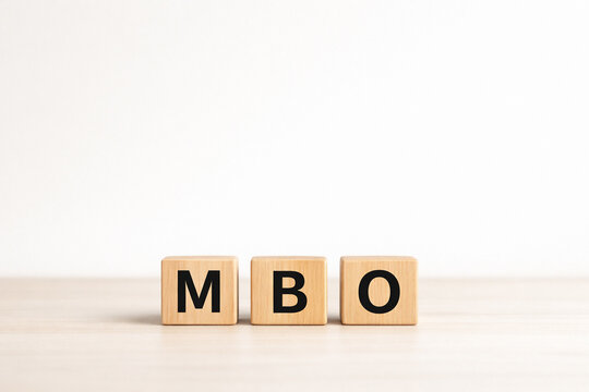 MBO Concept with Wooden Letter Blocks and Copy Space, Business Management Buyout Strategy Background MBO（マネジメントバイアウト）のビジネスコンセプト 木製ブロックと余白背景