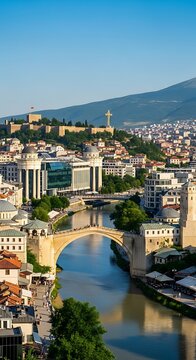 Skopje cityscape with Stone Bridge and Vardar River under blue sky.
