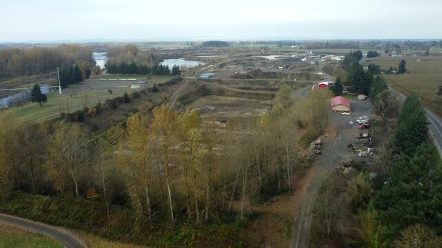 US, OR, Eugene, , 2025-11-23 - Drone view of a dug out sand quarry at RiverBend Materials at Coburg Road Quarry in fall