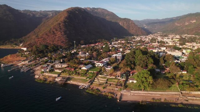 Panajachel, Guatemala with the Sierra Madre mountains, 4K drone shot at Lake Atitlan.