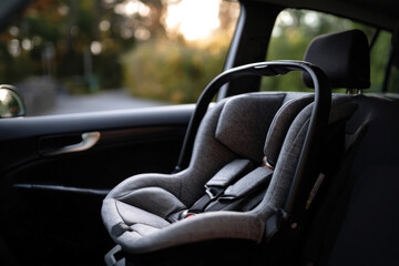 A sleek newborn car seat positioned in a car, its design emphasizes safety and comfort, embodying the essence of family travel and the excitement of new journeys.
