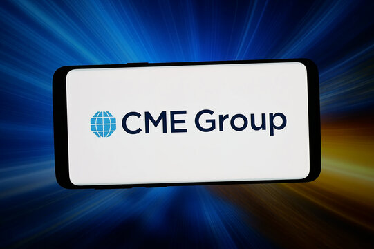 Stuttgart, Germany - 02-25-2026: In this photo illustration, the logo of US financial services company CME Group Inc. is displayed on a smartphone in front of abstract background on computer screen.