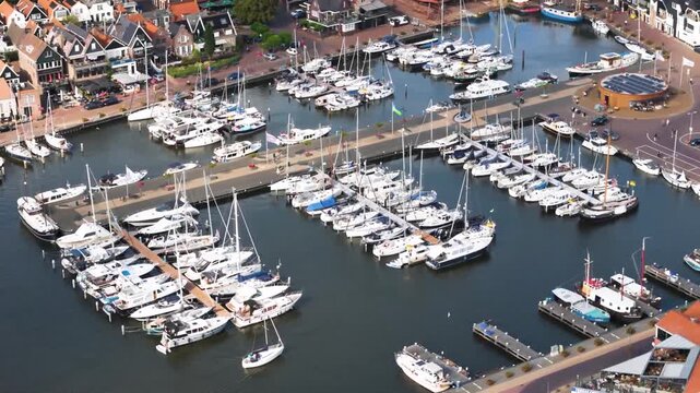 Aerial winter footage of Urk fishing village harbor and lighthouse