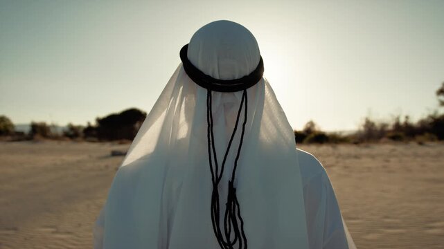 Sheik in Dishdasha dress in the desert 