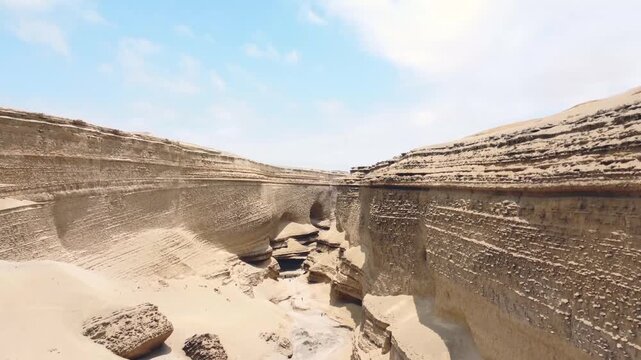 Drone aerial view,Ca&ntilde;on del Zapa (known as The Canyon of the Lost) is located, in the area called Montegrande, in Ica Peru, blue sky 4K.