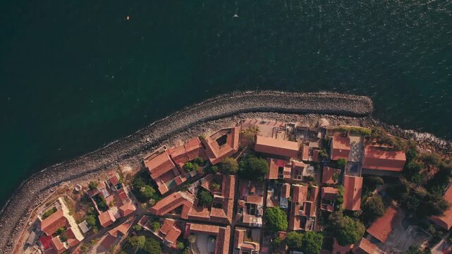 Aerial view of Gor&eacute;e Island, a UNESCO World Heritage site, is magical during the day with a magical sunset