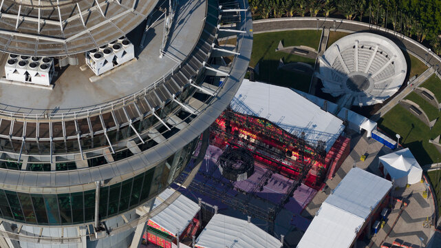 Macao, Macao - 16 February 2026: Aerial view of the Macau Tower's observation deck and surrounding structures, a blend of glass, metal, and concrete against the city's skyline.