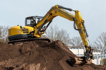 Yellow excavator working on a construction site