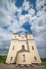 Obraz premium Baroque Catholic Church of St. Michael the Archangel in Mikhalishki Belarus with Sky Copy Space