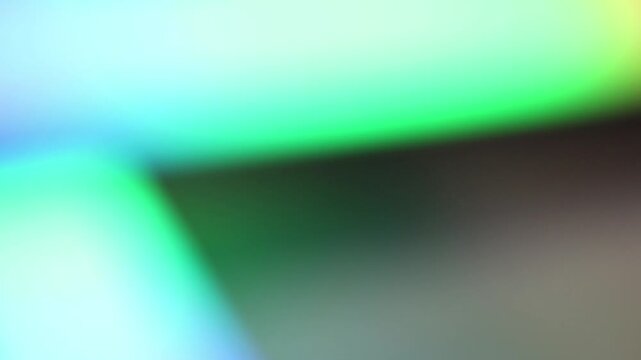 Abstract neon bokeh background with flowing colorful lights in soft focus.