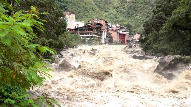 Scenic dramatic view with the powerful waters of Urubamba River crossing the Sacred Valley in Aguas Calientes