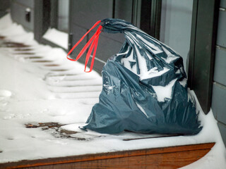 garbage sack left outside of a house