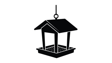 Black bird feeder hanging from a loop a striking silhouette © MdMosharef