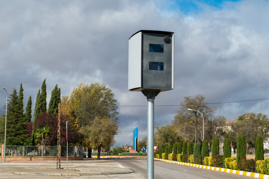 Speed ​​camera in Spain with a clody sky in background.