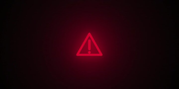 Red warning triangle animation against dark background viewed centrally