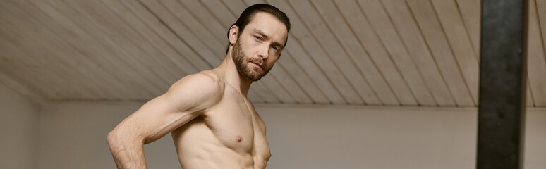 Handsome man stands confidently at home, embodying strength and charm in a relaxed atmosphere © Bliss