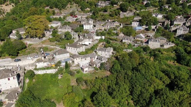 Top down aerial shot of stone houses and slate roofs in Papingo village Zagori Epirus Greece, traditional architecture in nature