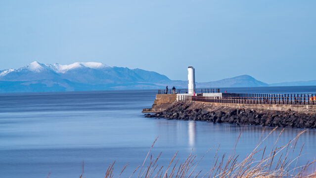 Snow capped hills of the Isle of Arran from Ayr shore on a sunny winters afternoon