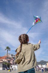 Girl flying kite