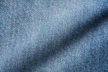 Close-up of blue indigo denim fabric texture background