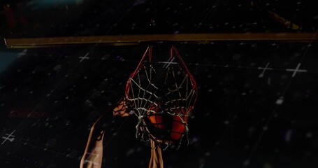 Dunking basketball player powering ball through rim and woven net at gym, sleeveless jersey © vectorfusionart