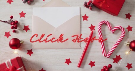 Showing beige envelope with white card on wood table, displaying red-neon Click Here and cane-heart