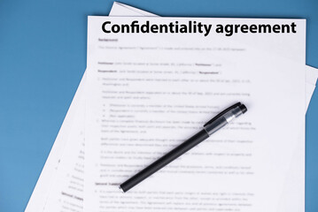Obraz premium Confidentiality agreement document on office desk, legal contract for business privacy, nondisclosure and corporate security concept.