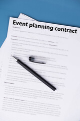 Event planning contract on desk, professional agreement for organizing celebrations and corporate events, symbol of cooperation, creativity, and business partnership.