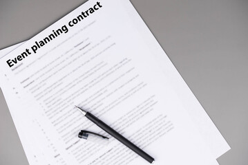 Event planning contract on desk, professional agreement for organizing celebrations and corporate events, symbol of cooperation, creativity, and business partnership.