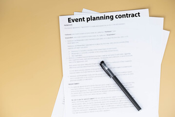 Obraz premium Event planning contract on desk, professional agreement for organizing celebrations and corporate events, symbol of cooperation, creativity, and business partnership.