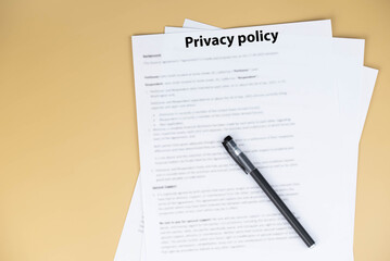 Obraz premium Privacy policy document on desk, legal statement explaining how personal data is collected, used, shared, and protected, symbol of transparency, trust, and online compliance.