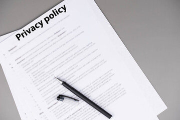 Obraz premium Privacy policy document on desk, legal statement explaining how personal data is collected, used, shared, and protected, symbol of transparency, trust, and online compliance.