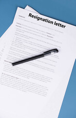 Resignation letter on office desk, formal document where employee voluntarily leaves job, symbol of professional change, career transition, and emotional decision at workplace.